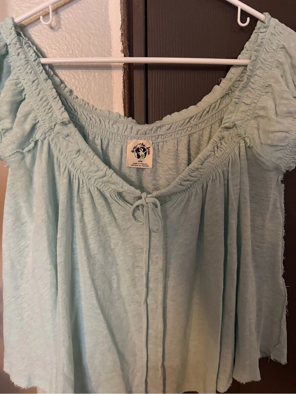 Brand new FREE PEOPLE brand.  We The Free Mint Green Peasant Tie-Front Tunic